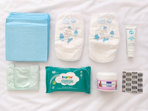 Little Caddie Top-Up Pack contents including nappies, changing mats, nappy bags, baby wipes, hand sanitiser, nappy cream and plasters.