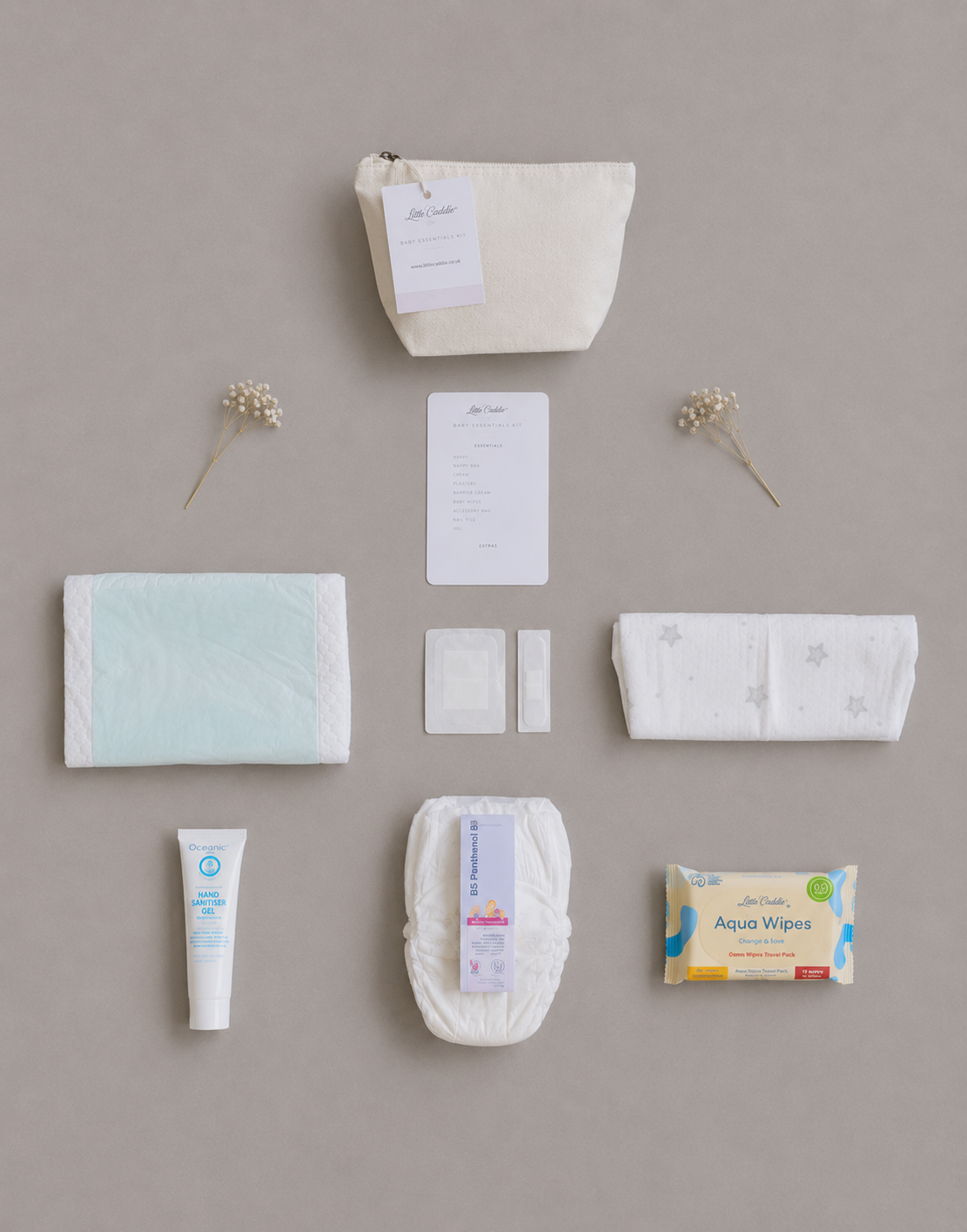 Little Caddie Co Mini Baby Emergency Kit with everyday essentials neatly displayed.