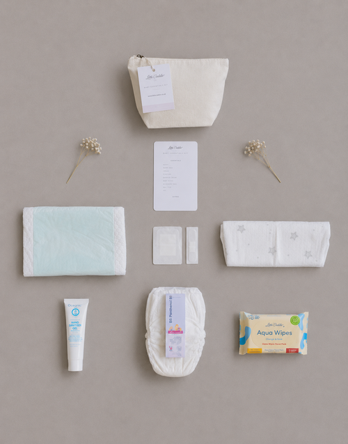 Little Caddie Co Mini Baby Emergency Kit with everyday essentials neatly displayed.